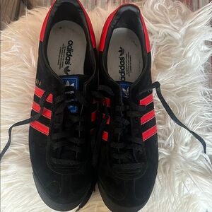 Adidas Black and Red Sneakers with Signature Stripes